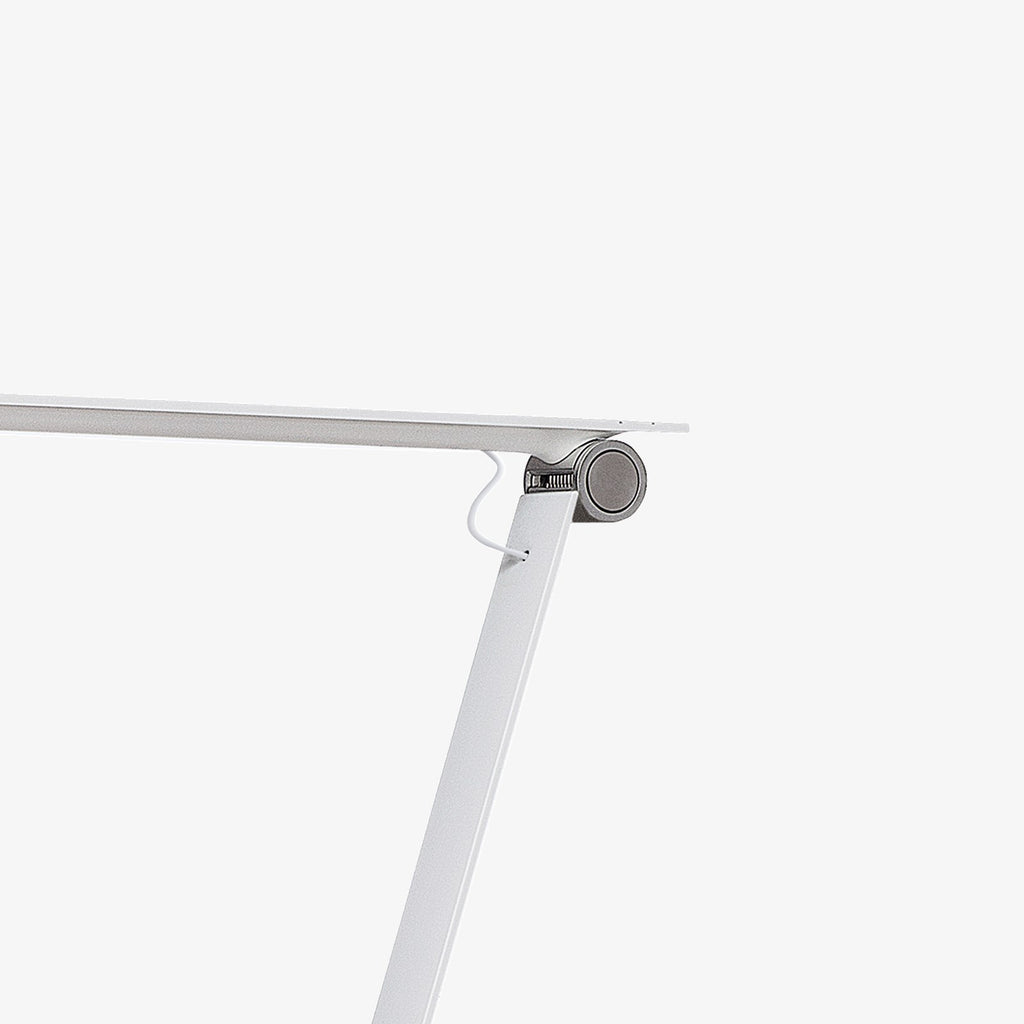 The NJP Table Lamp is a new interpretation of a classic architect lamp designed by Nendo design studio of Japan and designer Oki Sato. Its simple and honest look bares the lamp's functional components and makes it self-explanatory in its expression. The lamp features a timer function that can be set to turn the lamp off at after four or eight hours. Its ergonomic design and simple mechanical system provides great freedom of movement, so that light can always be set in the ideal position in the workspace.