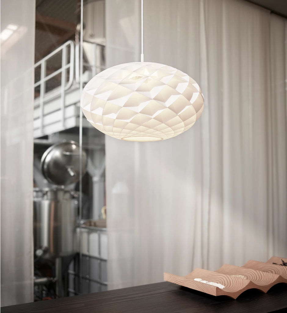 The timeless Patera Oval Pendant follows the same elegant design principles as the circular Patera Pendant and is assembled entirely by hand. Danish designer Øivind Slaatto took inspiration from the Fibonacci spiral and designed the pendant to following the mathematic structure of the captivating Fibonacci spiral.