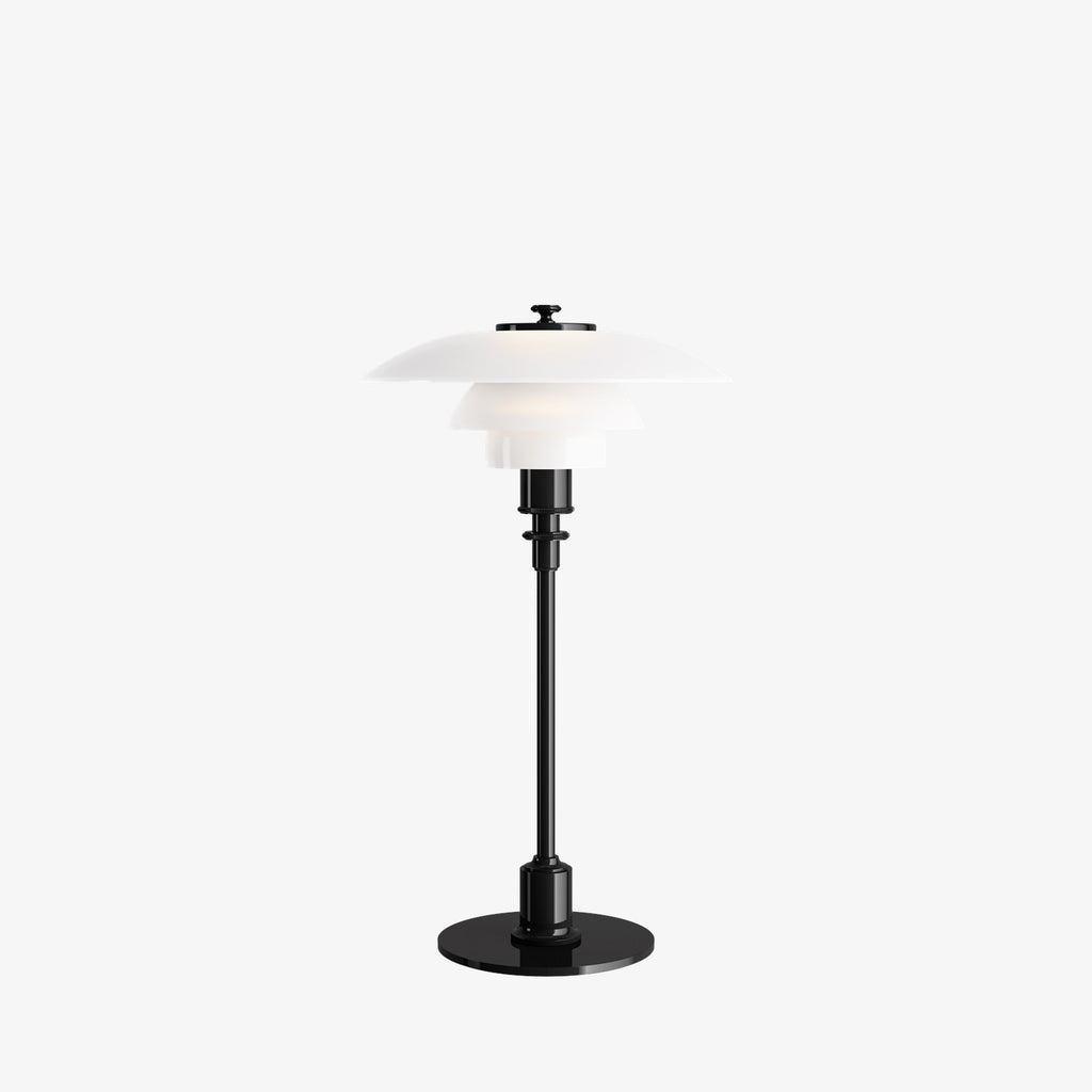 The PH 2/1 Table Light by Paul Henningsen for Louis Poulsen features a triple-layer hand blown glass shade that rests on a beautiful, lightly brushed brass frame, which references the original PH Table Lamp from 1927. Its design evokes timeless elegance with its use of classic materials. Complimenting environments both simple and eclectic, the PH 2/1 boasts a small profile making the lamp endlessly adaptable anywhere within the home, like on a windowsill or small table. 