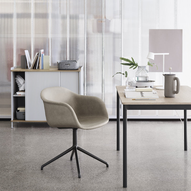 The Platform Tray by Muuto in gray in a commercial office.