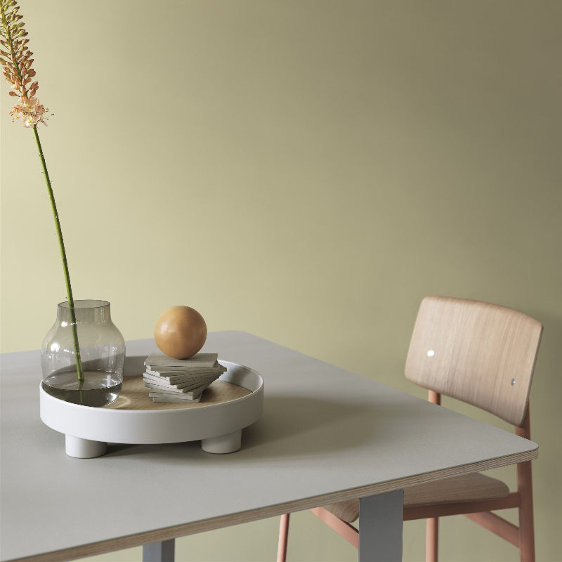 The Platform Tray by Muuto in gray in a dining room.