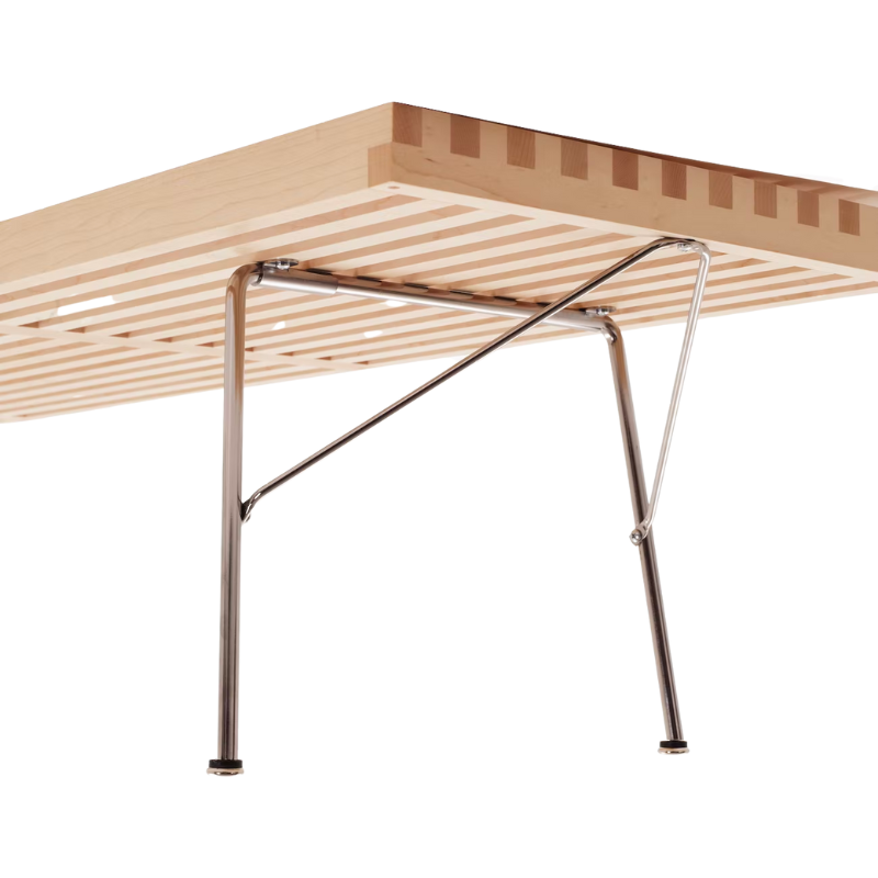The Nelson Platform Bench from Herman Miller in maple with the metal base in a photograph showing underneath the seat.