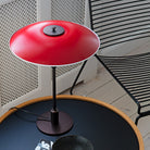 The PH 3½-2½ table lamp is designed based on the principle of a reflective three-shade system, which directs the majority of the light downwards. The shades are made of mouth-blown opal three-layer glass, which is glossy on top and sandblasted matt on the underside, giving a soft and diffuse light distribution. Designed by Poul Henningsen.